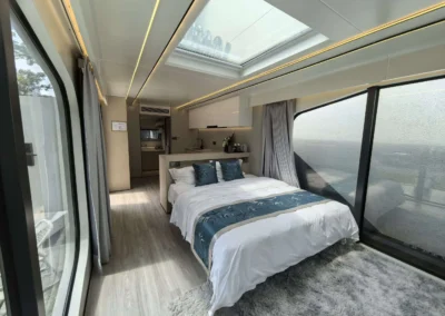 BAUSTADT G50 capsule house bedroom with panoramic window and modern interior design